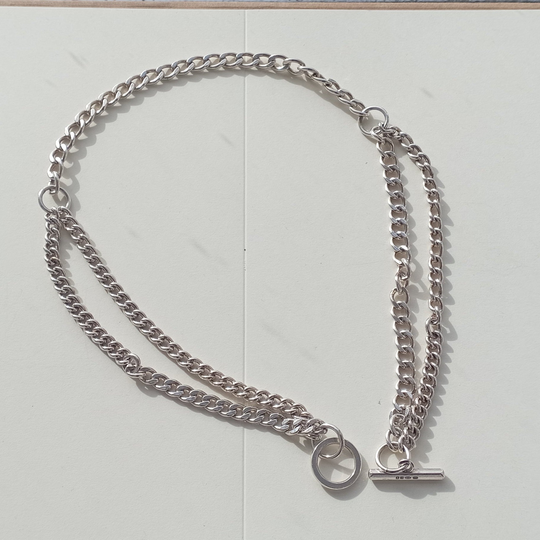 Double toggle choker